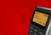 SMS vor Vodafone-Hintergrund