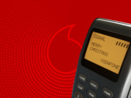 SMS vor Vodafone-Hintergrund