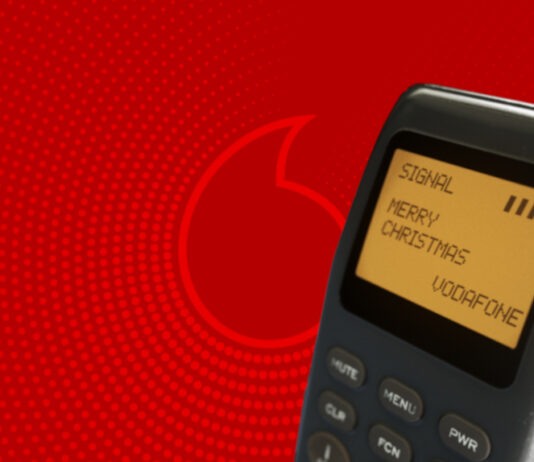 SMS vor Vodafone-Hintergrund