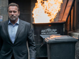 Arnold Schwarzenegger vor brennendem Müll