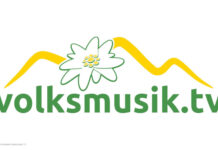 Neues Logo von Volksmusik.tv mit einer Blüte und angedeuteten Bergen über dem Schriftzug.