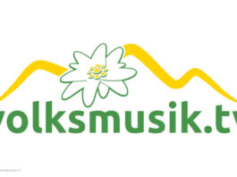 Neues Logo von Volksmusik.tv mit einer Blüte und angedeuteten Bergen über dem Schriftzug.