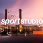 Schriftzug "ZDF Sportstudio live" vor Stadion mit Olympischen Ringen.