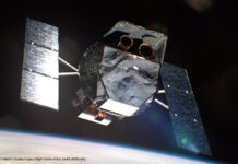 Ein Renderbild eines Satelliten, im Hintergrund ist die Erde zu sehen.